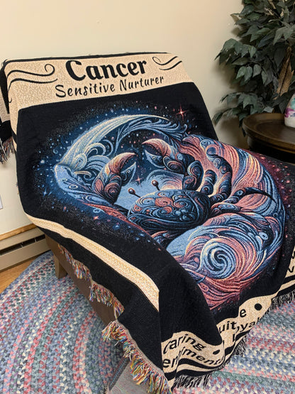 Cancer Zodiac Sign Heirloom Blanket on leather chair_Mister Obtuse