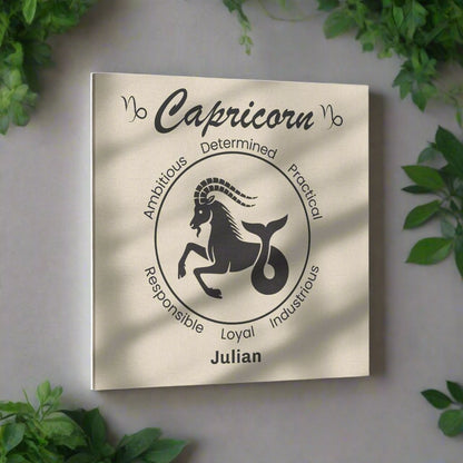 Capricorn Minimalist Personalized Square Canvas Wrap on light greyish blue wall with plants surrounding mister obtuse eclectic goods